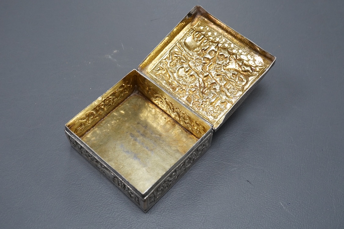 An Indian small square white metal cigarette box, embossed with animals and figures, width 78mm, 4.4oz.